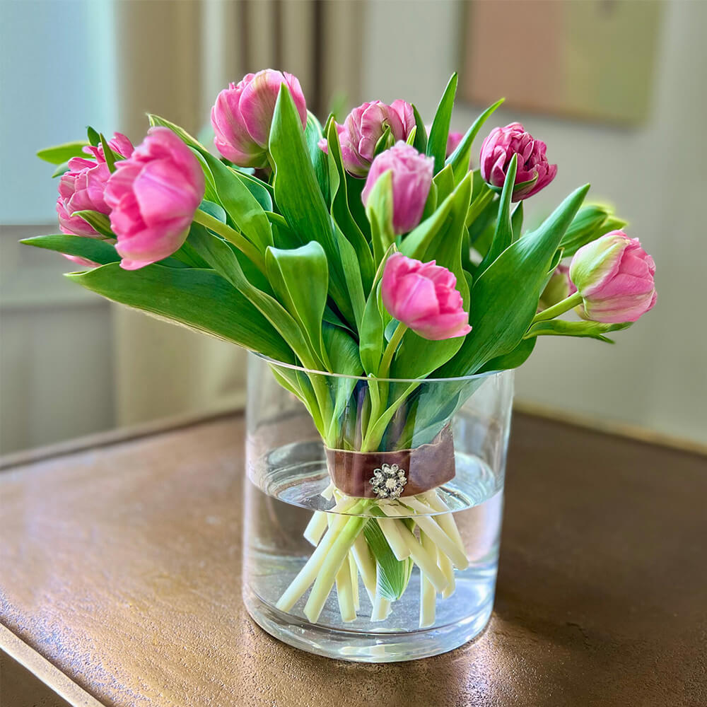 pink tulips in clear vase